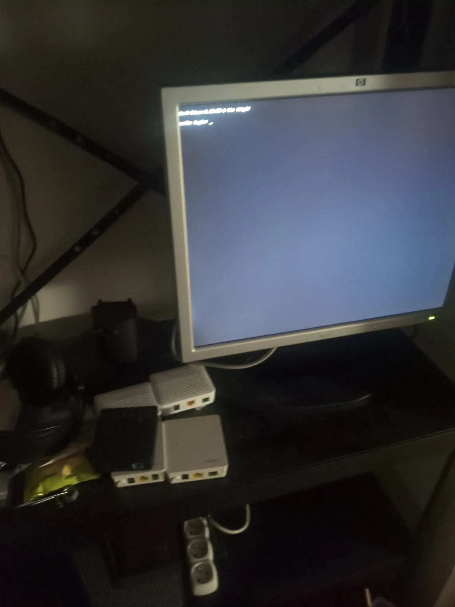 Ikea BROR rack with monitor and 5 GPON ONTs next to it.
